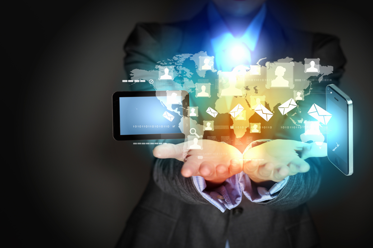 Man holding digital devices in his hands