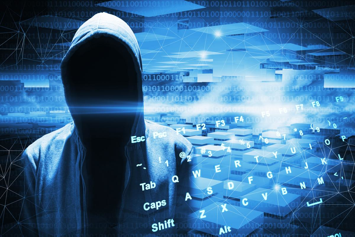 Hacker lurking in shadows